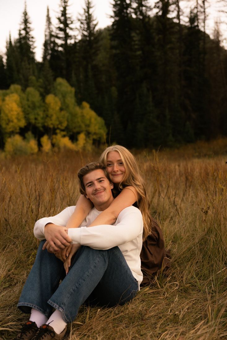 Garrett and Adeline sitting in the tall grass